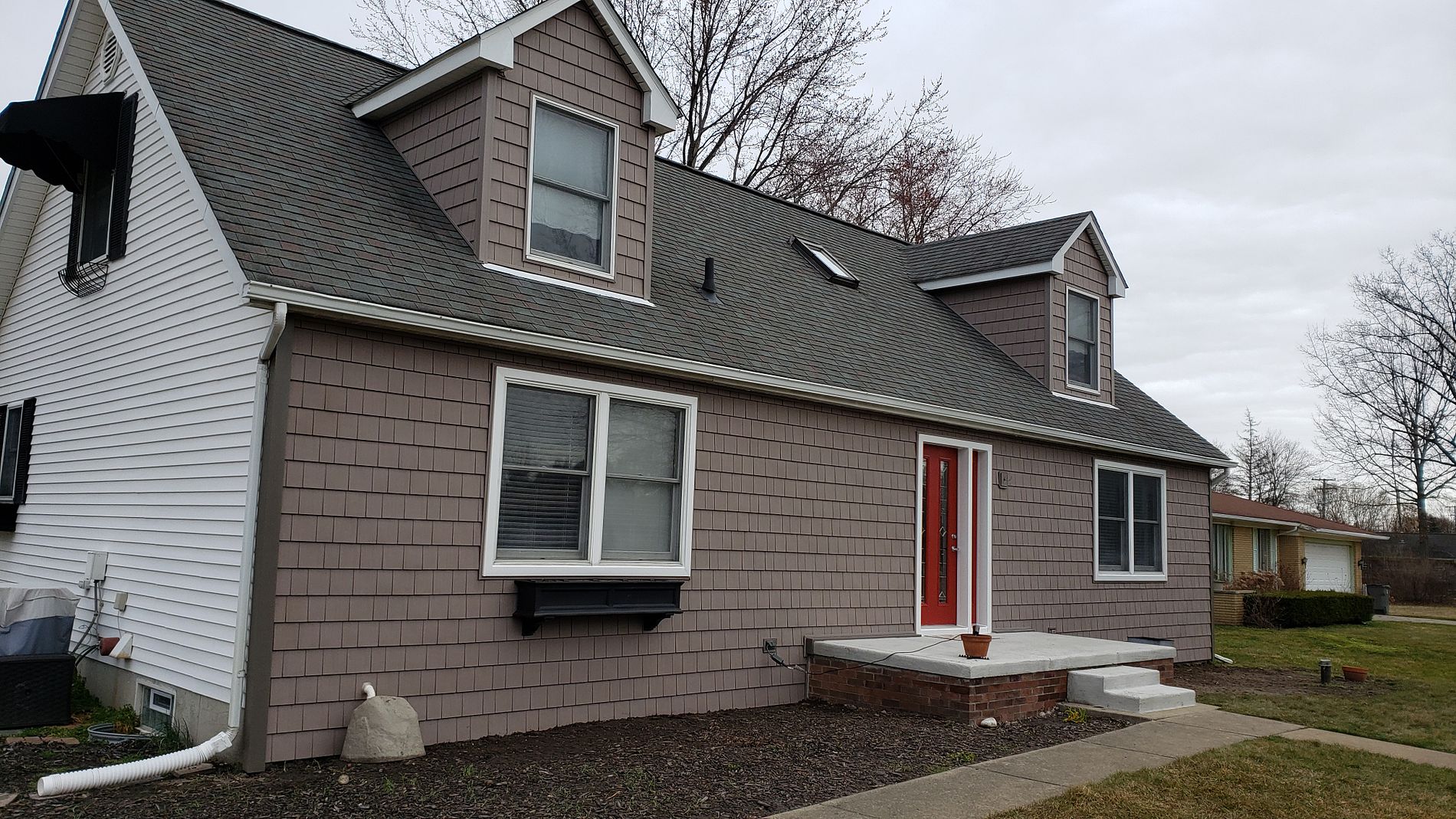 A After image of a siding installation in Clinton Township MI on Faulman Road