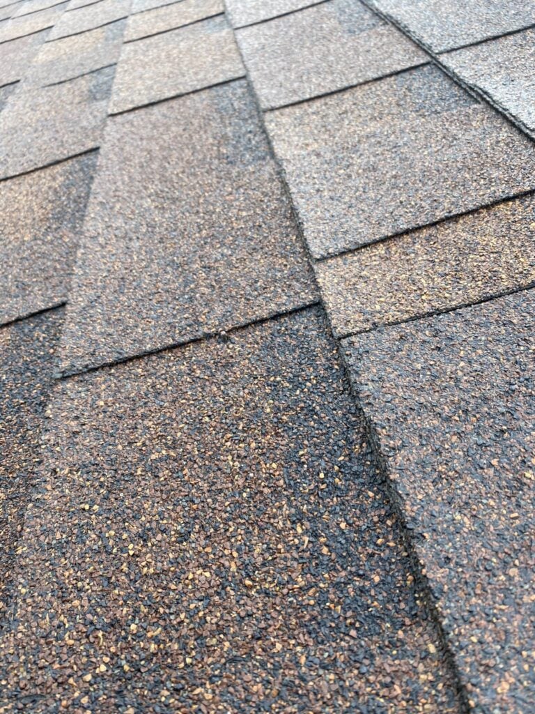 Close-up of new architectural asphalt shingles from a roof replacement on Greater Mack Avenue in St. Clair Shores, MI