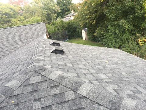Newly shingled light gray roof with ridge vents on Hutchins Hill Drive in West Bloomfield, MI